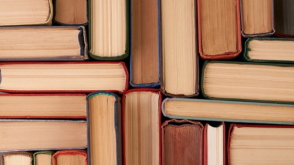 stacks of hardback books