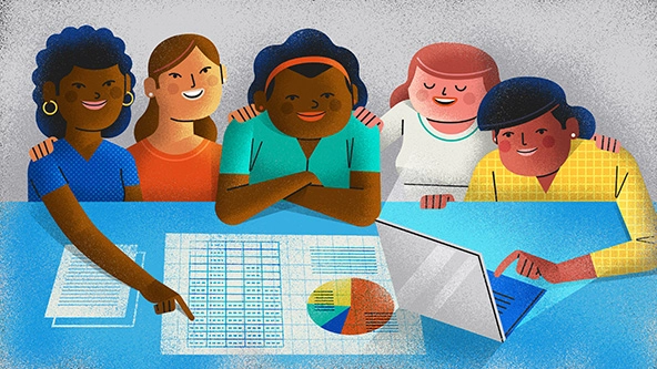 diverse group of people sitting at a table lookin at data, graphs, and charts