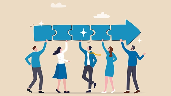 Five people connecting an arrow jigsaw puzzle above their heads