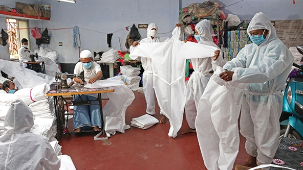 Workers making personal protective equipment