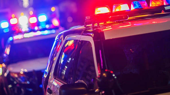 Flashing lights on two police cars at night