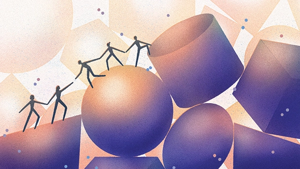 People helping others climb up a hill