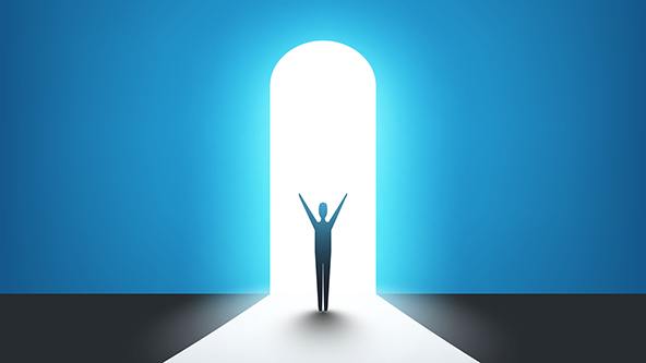 Man standing in front of a door, light at the end of the road