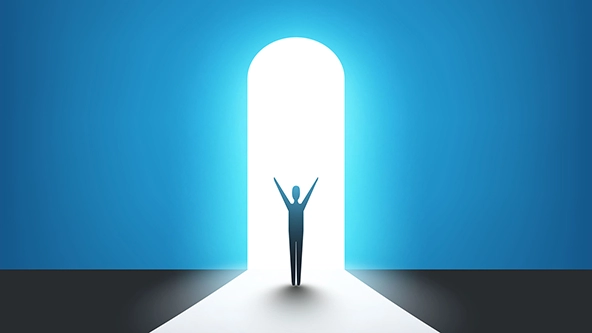 Man standing in front of a door, light at the end of the road