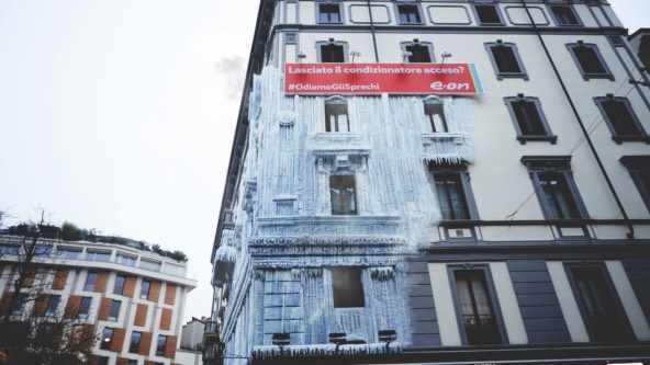 art installation featuring E.ON Italia branding on a downtown Milan apartment