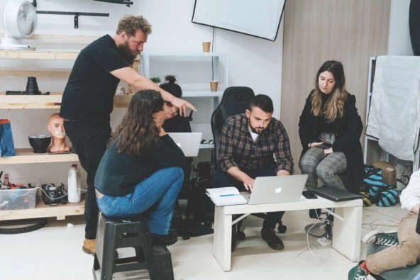 reporters in a training session in a casual office environment