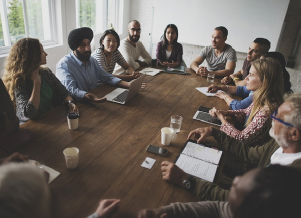 People sitting around a table having discussion
