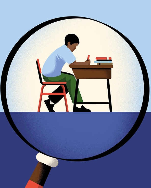 A magnifying glass over a student sitting at a school desk