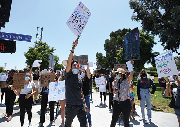 students holding signs that say 