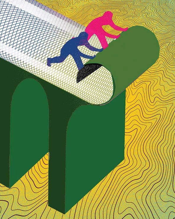 Two people putting down a road on an elevated platform