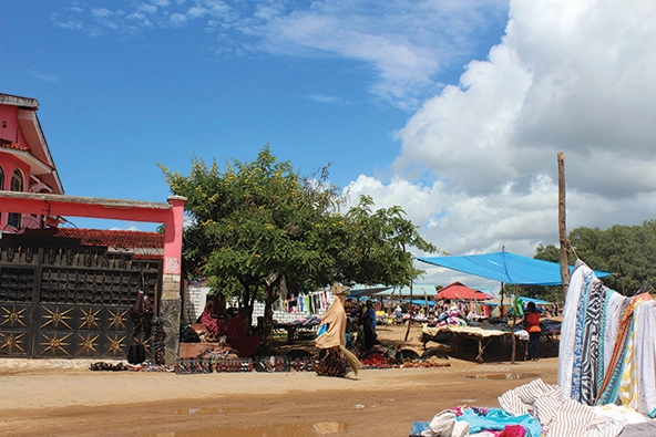 view of an outdoor market with vendors under tents