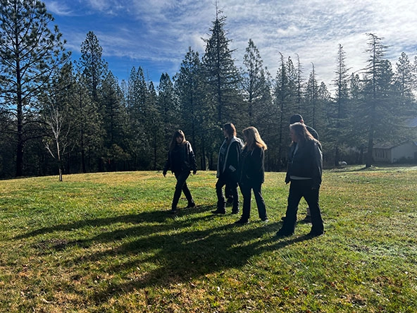 women walking together across a field